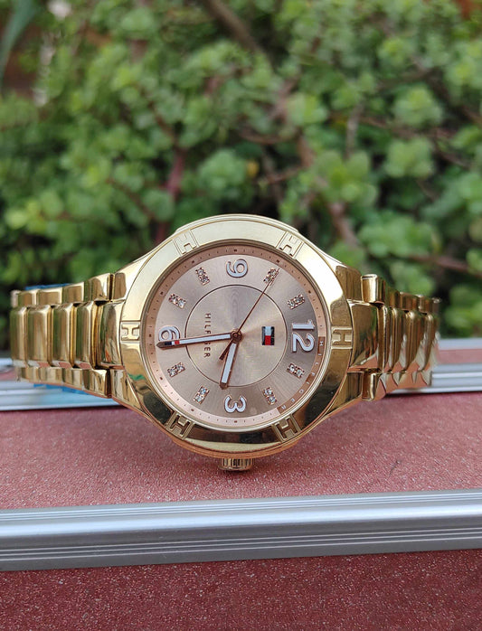 Tommy Hilfiger Pink Dial Gold Colour Watch for women